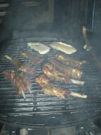 Ribs getting happy on the grill.